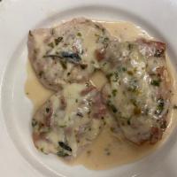 Saltimbocca alla Romana with Veal · Veal topped with prosciutto and Swiss cheese sauteed in a Marsala and cream sauce with sage.