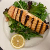 Salmon alla Griglia · Grilled salmon dressed with olive oil, garlic and lemon sauce.