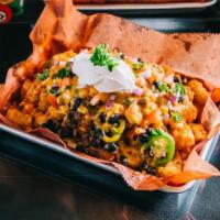 Loaded Nachos · Nacho chips, Beef Chili, jalapenos, nacho cheese and sour cream. 