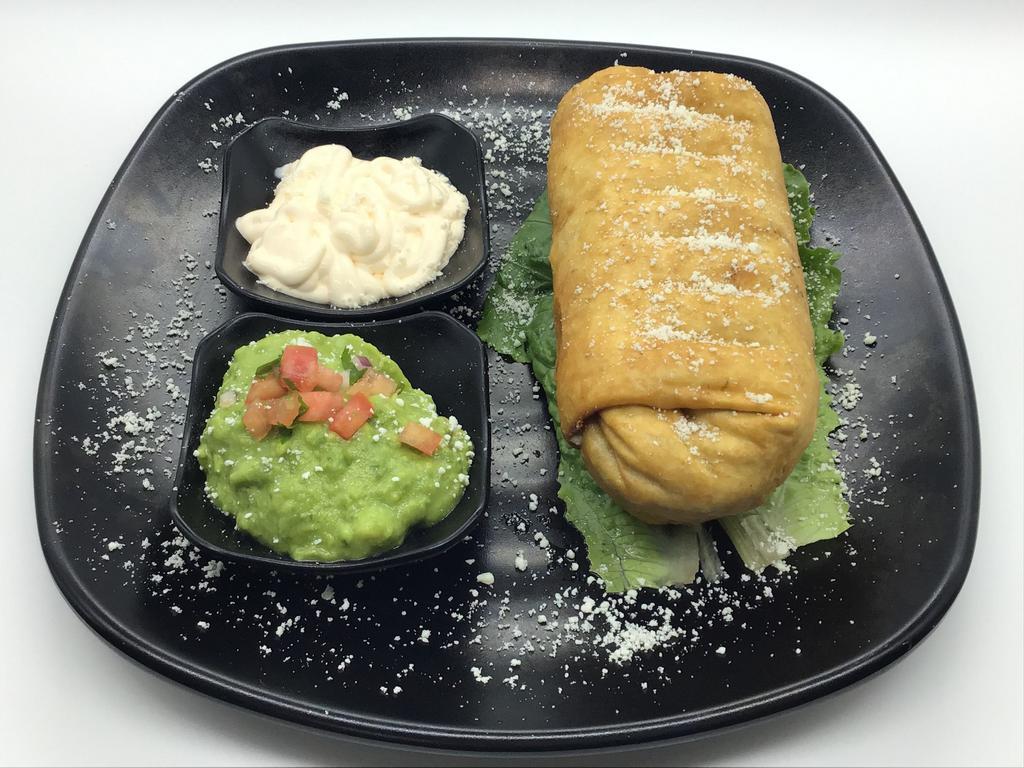 BURRITO CHIMICHANGA · flour tortilla deep fried stuffed with rice, beans, choice of meat, cheese topped with sour cream, cotija cheese and guacamole
