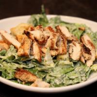 Caesar Salad · Romaine lettuce tossed with our homemade Caesar dressing with Parmesan cheese and croutons.