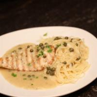 Chicken Piccata · Grilled chicken breast sauteed with capers, in a delicate lemon butter sauce served with ang...
