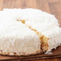 Coconut Cream Cake - Whole · Moist coconut syrup-soaked white cake layers filled with creamy coconut custard and sweet to...