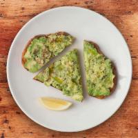 Avocado Toast · Fresh smashed avocado on toasted country bread with olive oil drizzle and lemon.