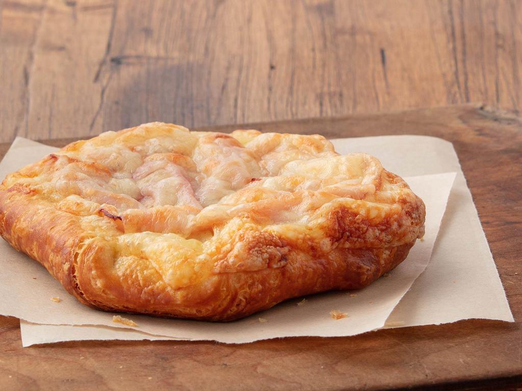Ham & Swiss Croissant Square · Sliced ham and Swiss baked into flaky croissant dough. Perfect for breakfast on the go.