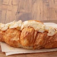 Almond Croissant · Butter croissant filled with rich almond cream and topped with sliced almonds.