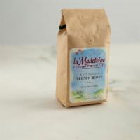 French Roast Coffee · A 12 ounce bag of a unique blend of 100% Arabica beans mixed exclusively for la Madeleine.