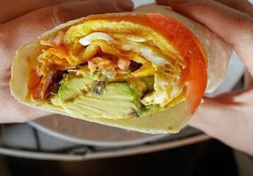 Breakfast Burrito · Egg and cheese, mayo, Sriracha, tomatoes, onions and sprouts.
