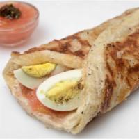 Malawach Wrap · Hard boiled egg, grated tomatoes, shug and green olives On a Yemenite flat bread. 