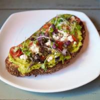 Avocado Toast · Avocado mash, feta cheese, cherry tomatoes and microgreens on 8 Grain.