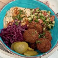 Falafel Bowl · Served with 2 Pita, Hummus, chopped salad, red cabbage, pickles, tahini and side shug.
