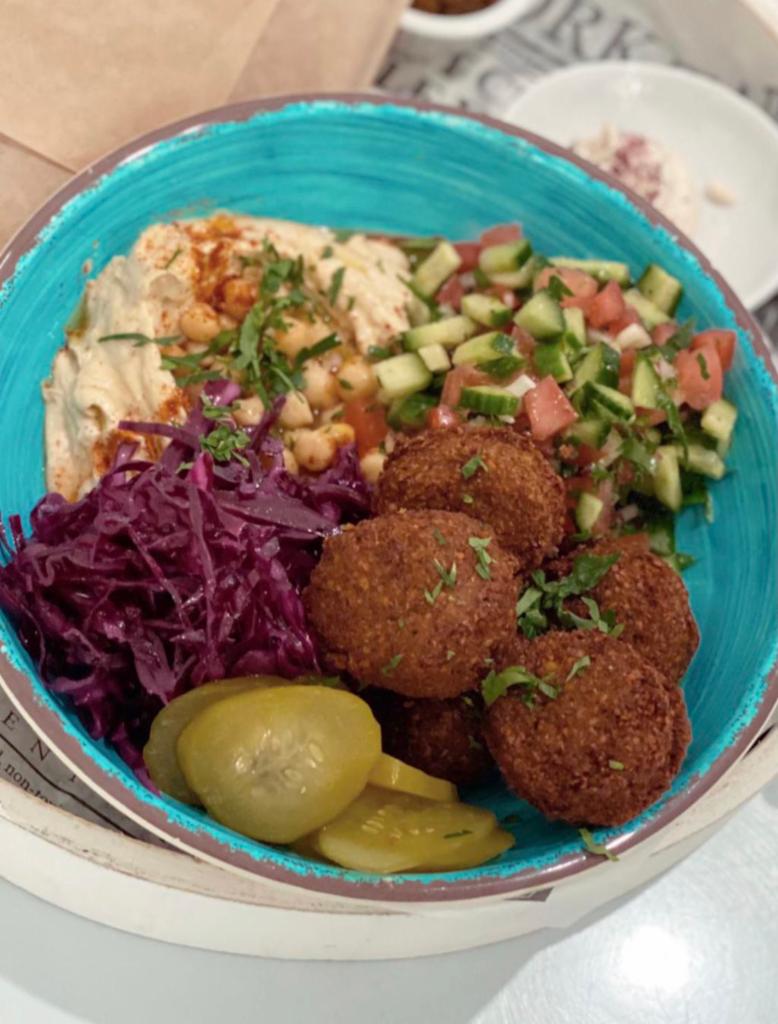 Falafel Bowl · Served with 2 Pita, Hummus, chopped salad, red cabbage, pickles, tahini and side shug.