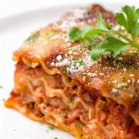Meat Lasagna  · Layers of baked lasagna loaded with beef, Parmesan, mozzarella and ricotta cheeses topped wi...