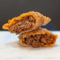 Chipotle Beef Empanada · Carne chipotle. Hot. Ground beef, smokey chipotle peppers, sweet peppers, onions and garlic.