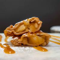 Apple Caramel Empanada A la Mode · Served with icecream.