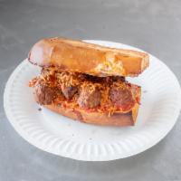 Meatball Parmesan · Baked meatballs, onions, mozzarella & Parmesan cheese on French bread with our homemade mari...