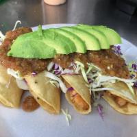 11 - Shrimp Tacos Dorados (Hard Shell) · Four crunchy Shrimp tacos topped with cabbage and a red sauce.
