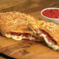 Pepperoni Calzone · Stuffed with pepperoni and our signature three cheeses; served with a side of our original p...