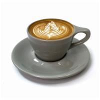 Latte · A double shot of espresso with a silky medium foam.