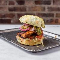 The Halsey Burger · Marinated Grilled Chicken Breast, Toasted Pesto Brioche, Guacamole, Pickled Red Onions, Lett...