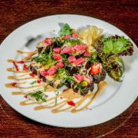 11. Ruby Roll Lunch  · Yellow tail, red snapper and cucumber, topped with diced spicy tuna, avocado, seaweed salad ...
