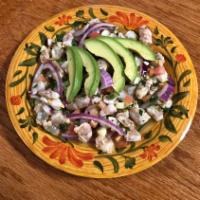 Ceviche de Camaron · Uncooked shrimp in freshly squeezed lemon juice with spicy green salsa purple onions,tomato,...