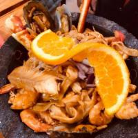 Molcajete Kora · Crab leg, mussels, imitation crab, shrimp, head on shrimp, octopus and tilapia in a mild spi...