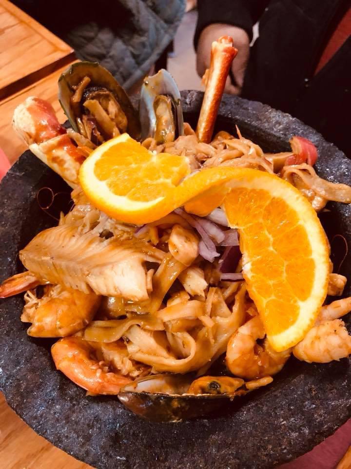 Molcajete Kora · Crab leg, mussels, imitation crab, shrimp, head on shrimp, octopus and tilapia in a mild spice sauce.