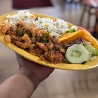 Camarones Rancheros · Shrimp in serrano,tomato,onion and cilantro served with salad,white rice, seasoned fries and...