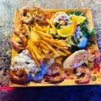Camarones a la plancha · Seasoned jumbo shrimp cooked on flat top grill served with salad,white rice, seasoned fries ...