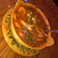 Caldo de Camaron con Cascara · Head on shrimp soup with mixed vegetables.