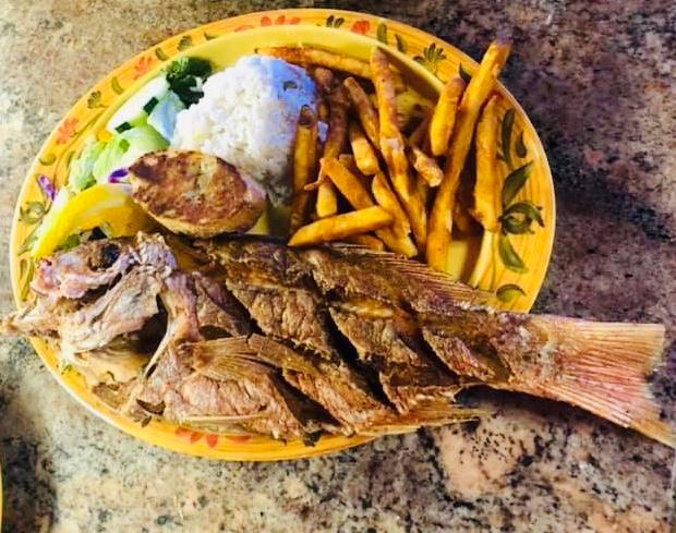 Huachinango al Natural · 2lb fried red snapper comes served with white rice, seasoned fries, salad and garlic bread.