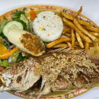 Huachinango al Ajo · 2 lb fried Red snapper with garlic sauce served with white rice, seasoned fries, salad and g...
