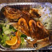 Huachinango la Playa · 2 lb fried red snapper topped shrimp and a mild spice house and served with white rice,seaso...