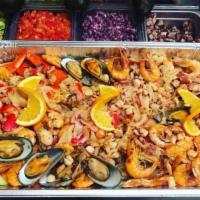 Levanta Muertos · Seafood mix of headless shrimp, head on shrimp, octopus, imitation crab, scallops, mussels a...