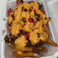 Loaded steak hot Cheetos fries  · Fries topped with grilled steak, hot chips and it’s all beautifully wrapped together with me...