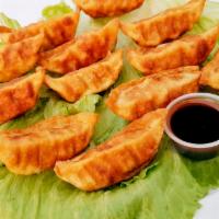 Crispy Gyoza · Meat and vegetable dumplings.