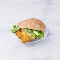 Spicy Buffalo Schnitzel Sandwich · Crispy breaded chicken cutlet with spicy Buffalo sauce.