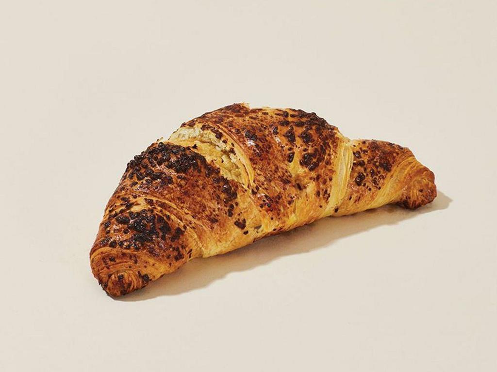 Chocolate Croissant · Our Chocolate croissant recipe contains flour, fine unsalted butter and the world’s finest cocoa. Perfectly flaky and baked to perfection in our bakers' ovens.