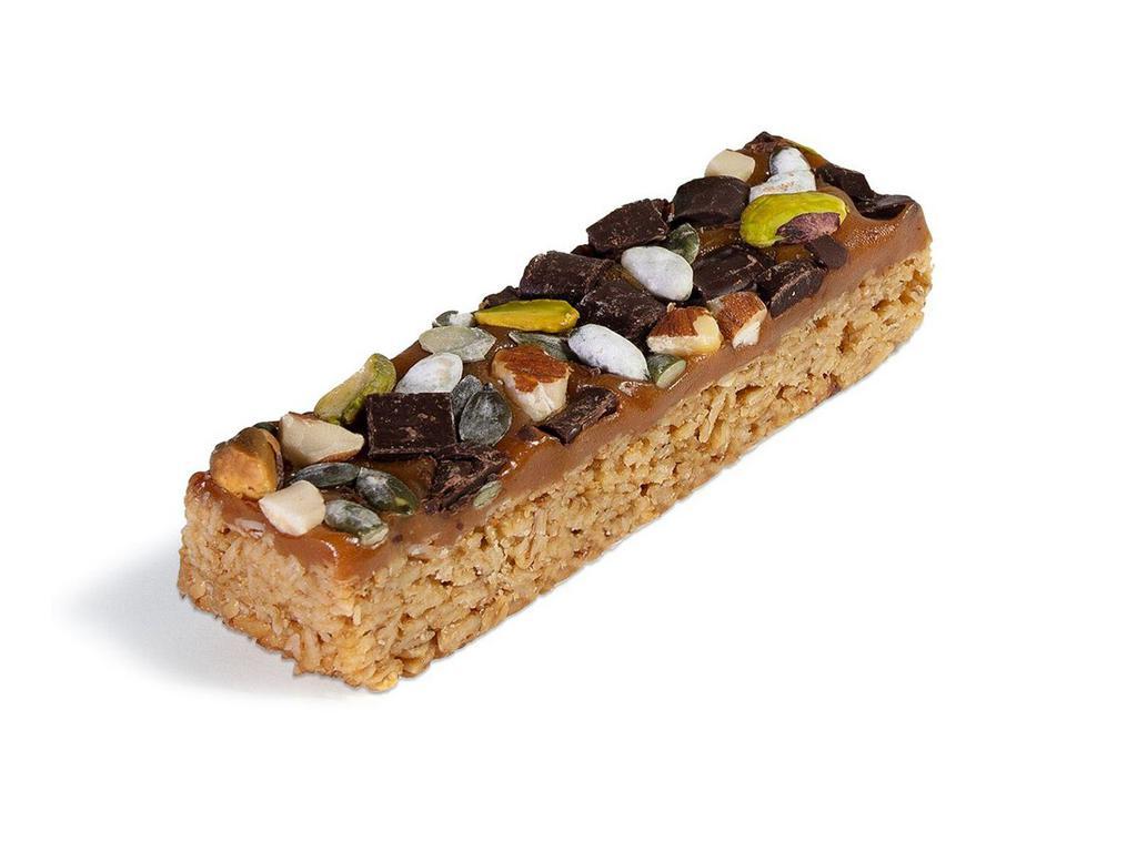 Love Bar · A wonderful combination of vanilla, pumpkin seeds, pistachios, almonds, and dark chocolate chunks on an oat base and drizzled with caramel.