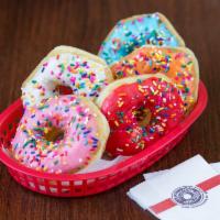 Assorted Yeast-Raised Do-nuts · Our traditional yeast-raised do-nut from comes in a variety of icing flavors with toppings s...