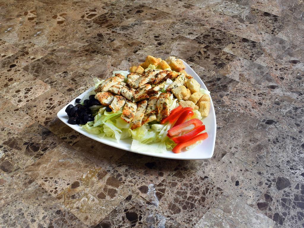 Grilled Chicken Caesar Salad · Romaine, grated cheese, grilled chicken, homemade Caesar dressing and crispy croutons.
