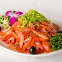 Achichuk Salad · Thinly sliced tomato and onions.