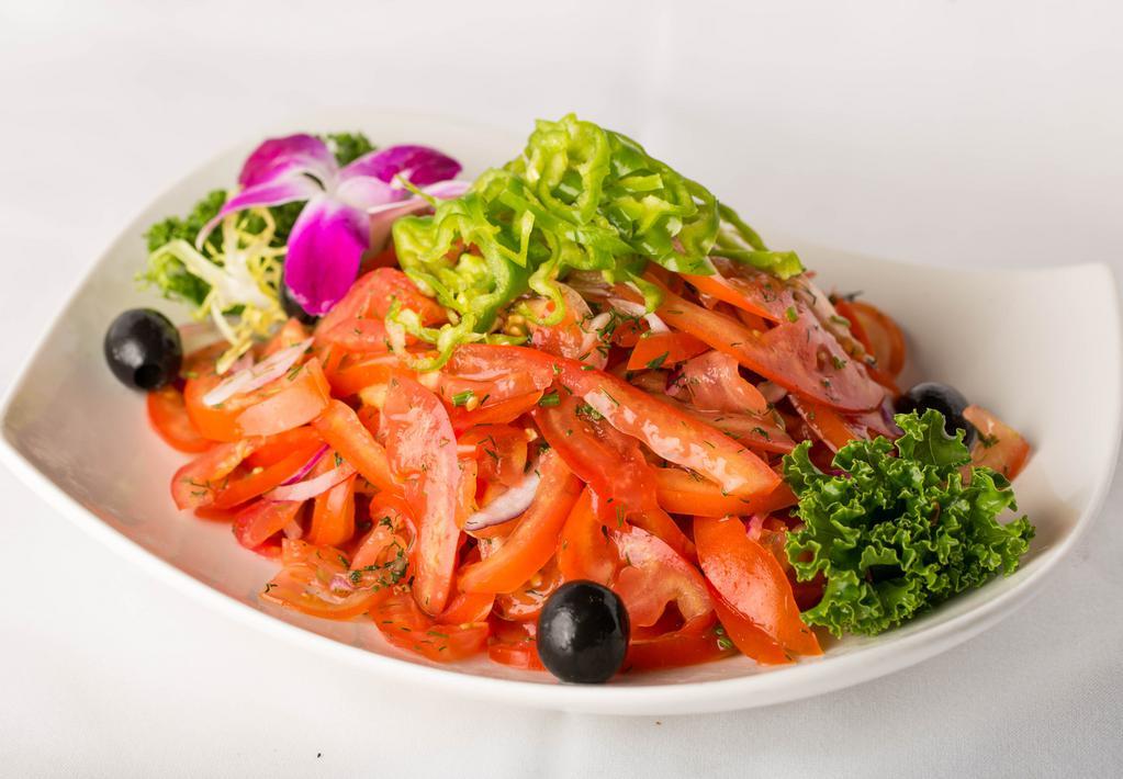 Achichuk Salad · Thinly sliced tomato and onions.