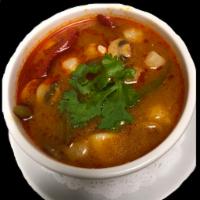 Tom Yum Koong Soup · Hot and sour soup with seafood and vegetables.