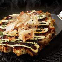 Seafood Okonomiyaki · Japanes pancakes with seafood, cabbage, special sauce, mayo & ‘dancing' bonito flakes for ga...
