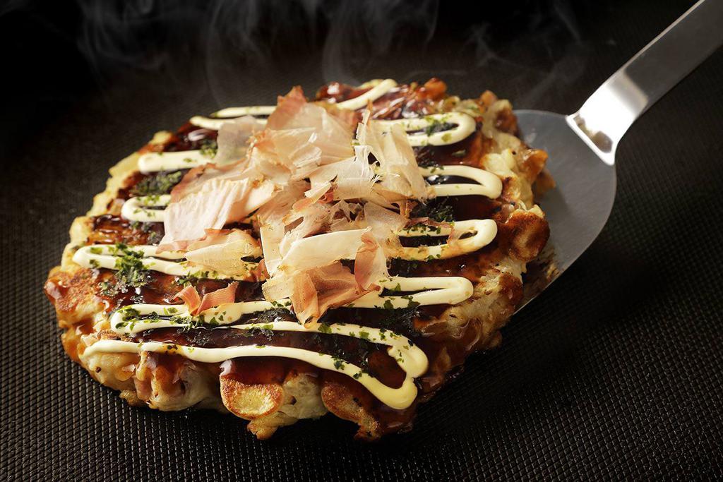 Seafood Okonomiyaki · Japanes pancakes with seafood, cabbage, special sauce, mayo & ‘dancing' bonito flakes for garnish