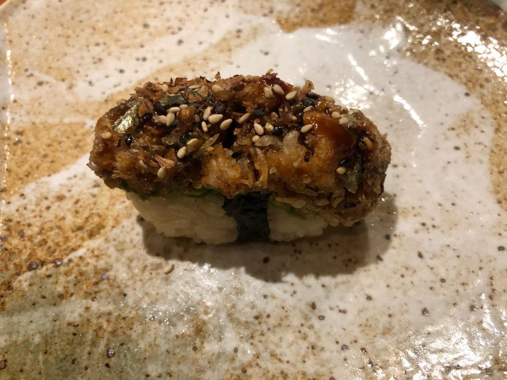 Chopped Eel Sushi · Torched eel with tempura crunchy & sesame seed, served on avocado slice.