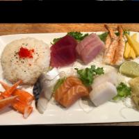 Chirashi · 15 pieces of chef's special assortment sashimi on sushi rice. Served with soup or salad.