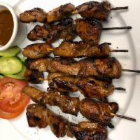 Island Satay · Grilled marinated chicken with peanut sauce. Served with soup or salad.